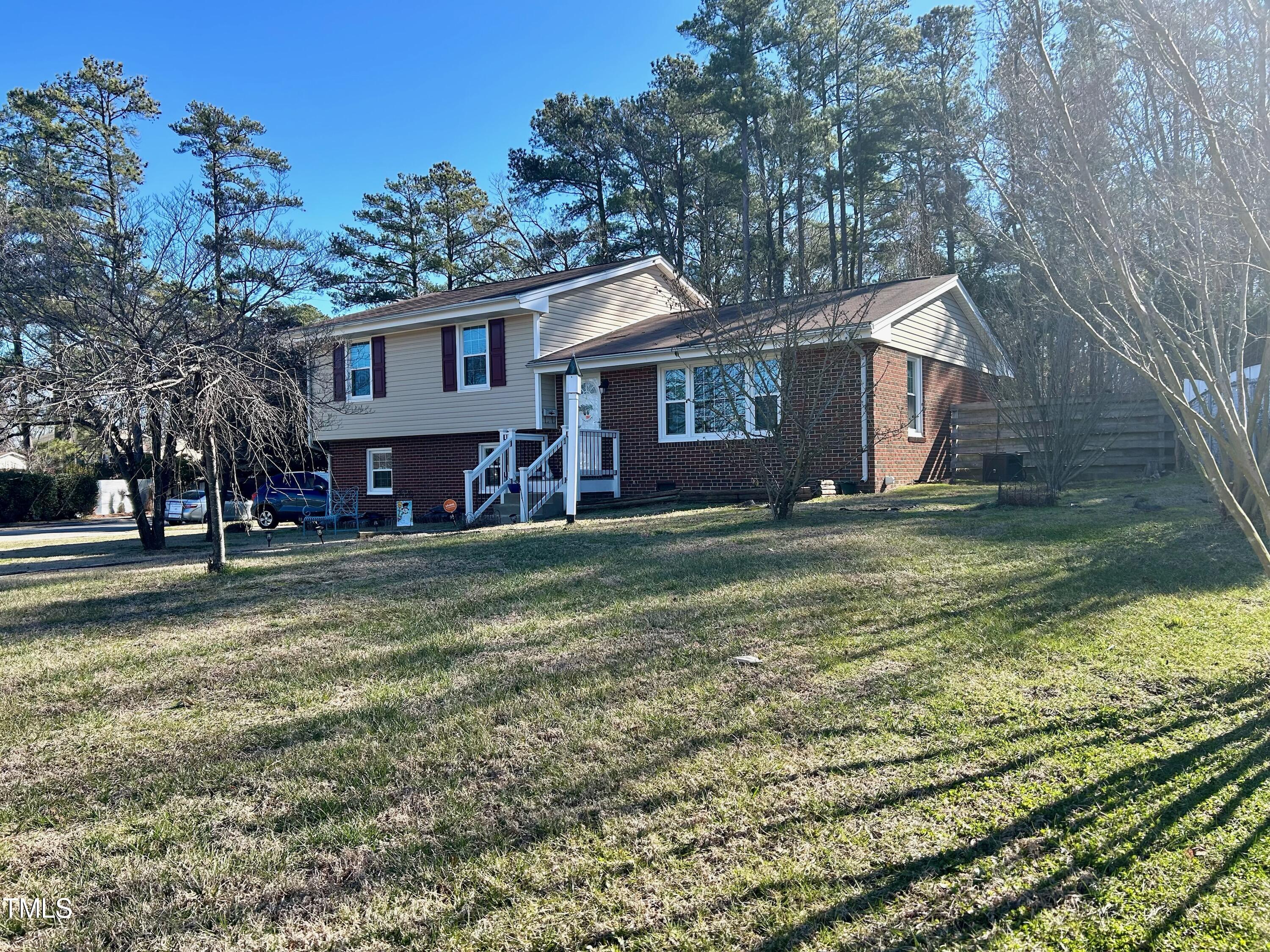 1320 North King Charles Road Raleigh, NC 27610 - Photo 1 of 21 a house view with a garden space