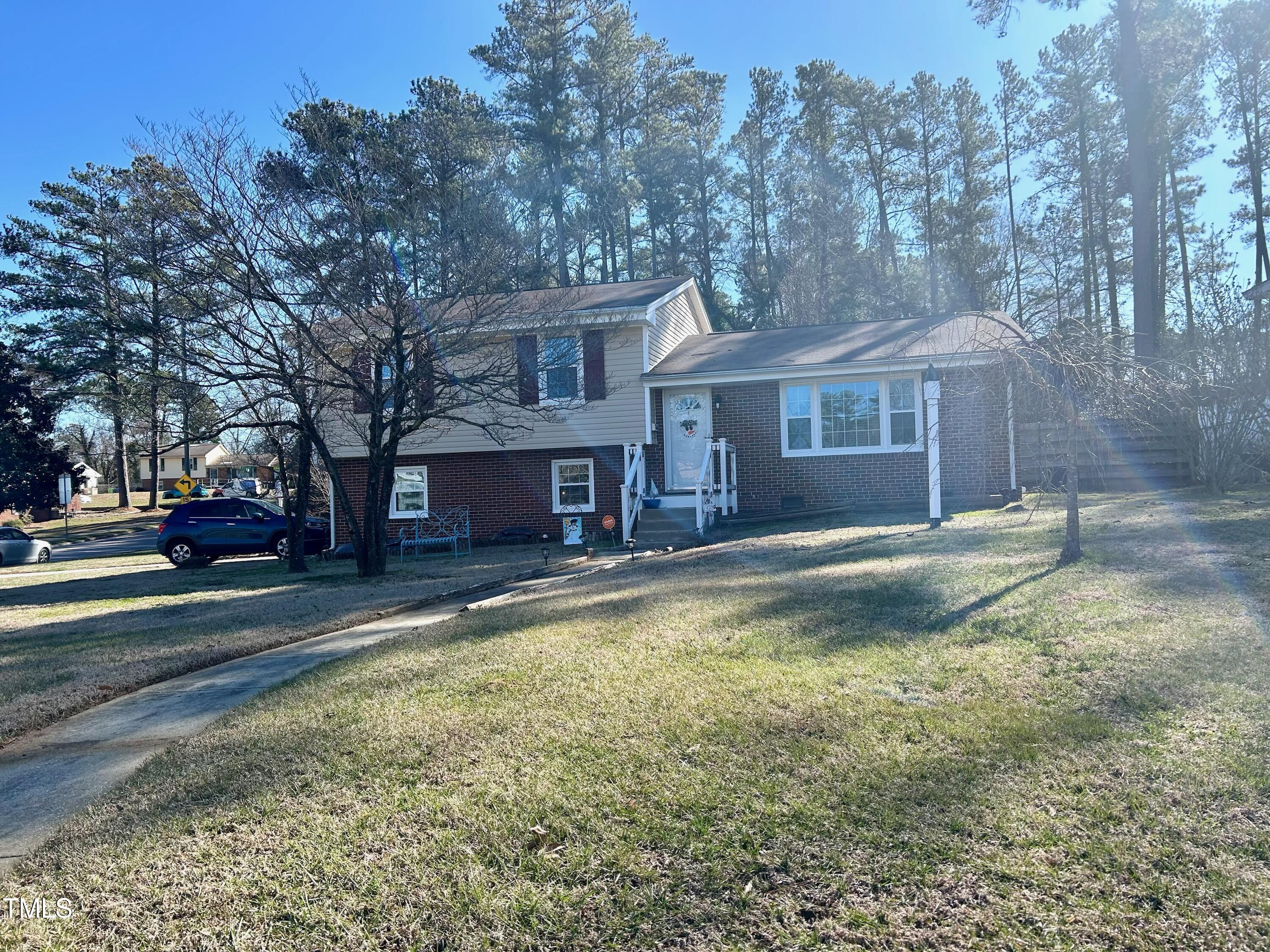 1320 North King Charles Road Raleigh, NC 27610 - Photo 2 of 21 a view of a house with a large tree in front of it