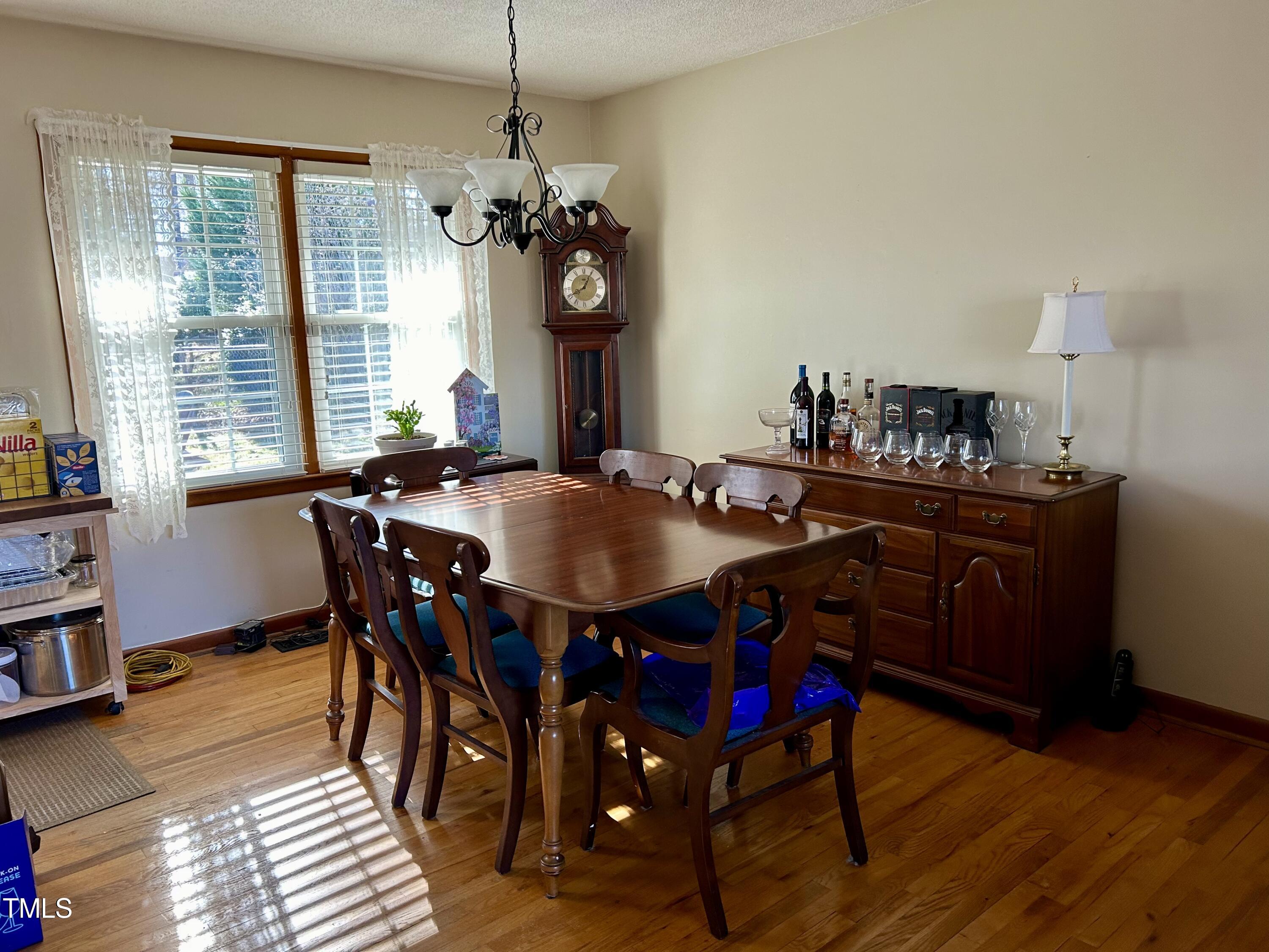 1320 North King Charles Road Raleigh, NC 27610 - Photo 9 of 21 a view of a dining room with furniture window and wooden floor