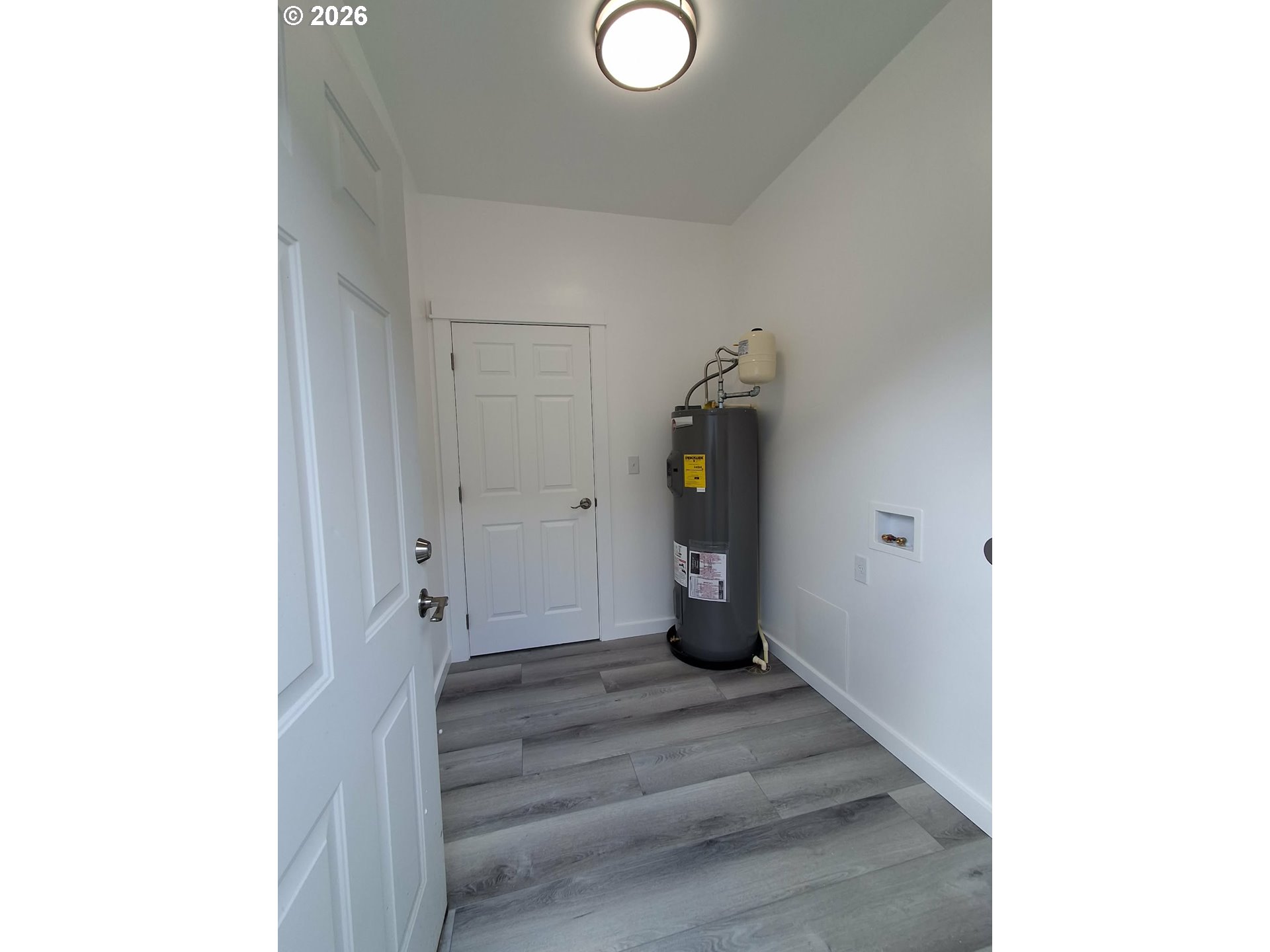 2008 True Loop La Grande, OR 97850 - Photo 15 of 16 a view of a hallway with wooden floor