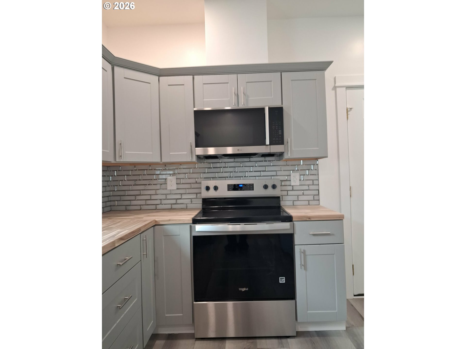 2008 True Loop La Grande, OR 97850 - Photo 6 of 16 a kitchen with a stove and a microwave