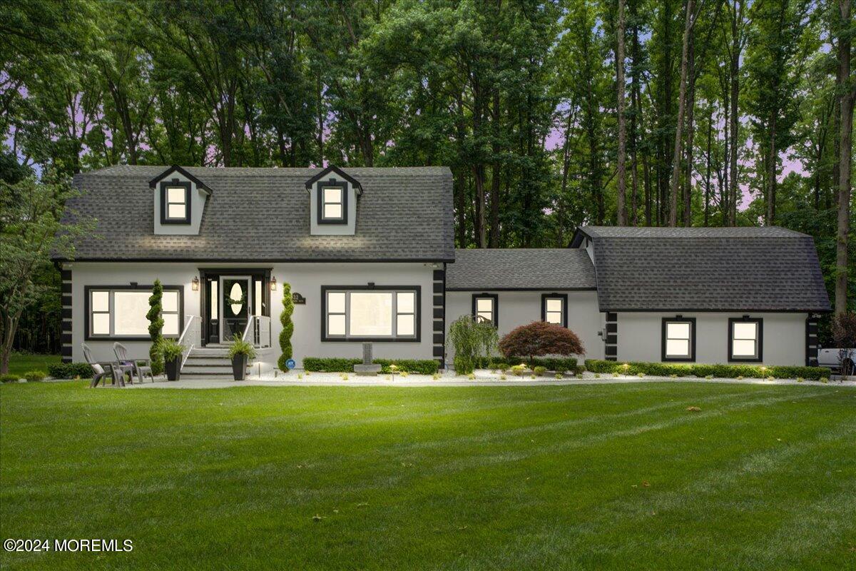 a front view of a house with a yard