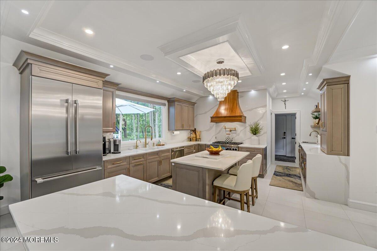 32 Devonshire Drive Morganville, NJ 07751 - Photo 14 of 53 a kitchen with lots of counter top space and refrigerator