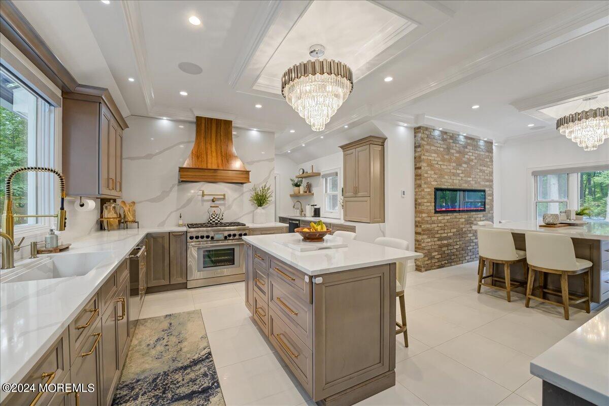 32 Devonshire Drive Morganville, NJ 07751 - Photo 18 of 53 a kitchen with lot of cabinets a sink a stove and a refrigerator