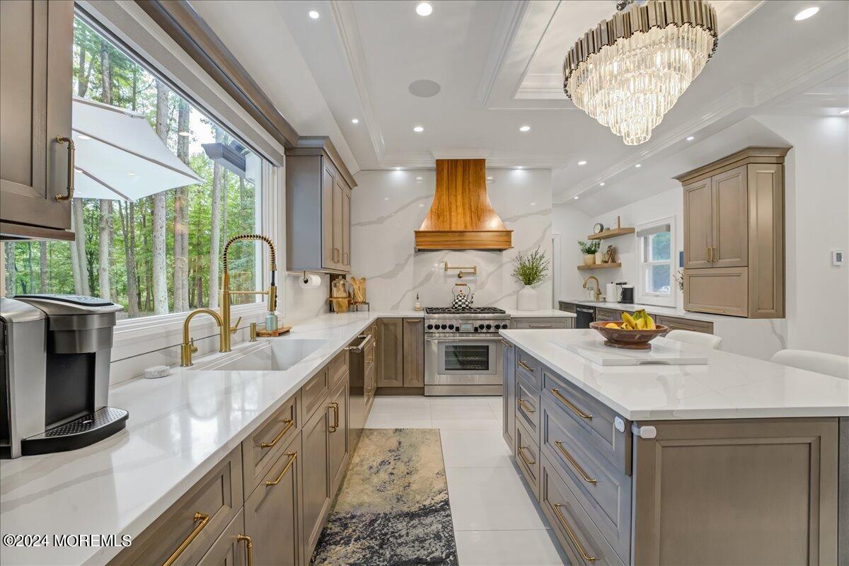 32 Devonshire Drive Morganville, NJ 07751 - Photo 19 of 53 a kitchen with stainless steel appliances granite countertop a sink stove and refrigerator