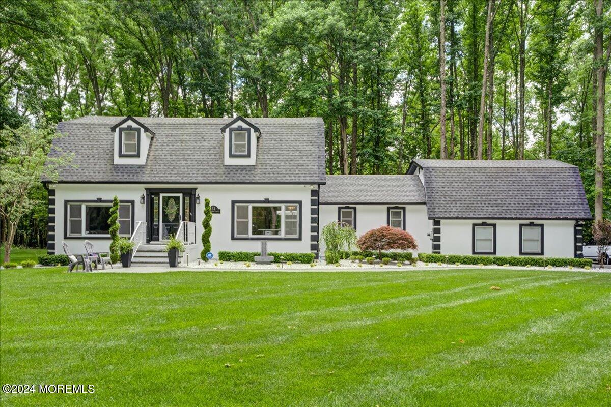 32 Devonshire Drive Morganville, NJ 07751 - Photo 2 of 53 a front view of a house with a yard