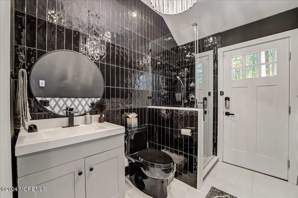 32 Devonshire Drive Morganville, NJ 07751 - Photo 24 of 53 a bathroom with a sink and mirror