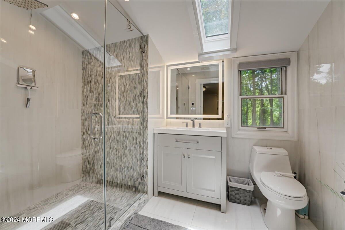 32 Devonshire Drive Morganville, NJ 07751 - Photo 29 of 53 a bathroom with a toilet sink and shower