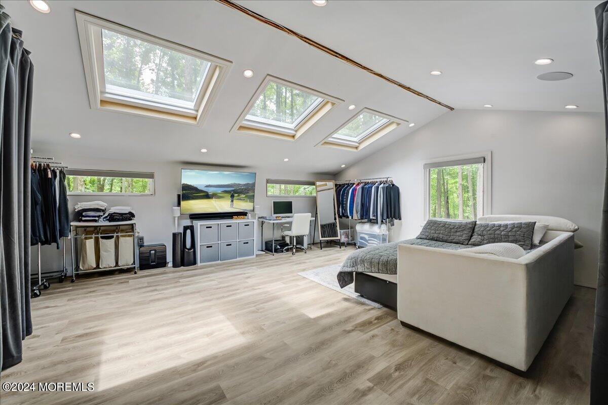 32 Devonshire Drive Morganville, NJ 07751 - Photo 33 of 53 a living room with furniture and a flat screen tv