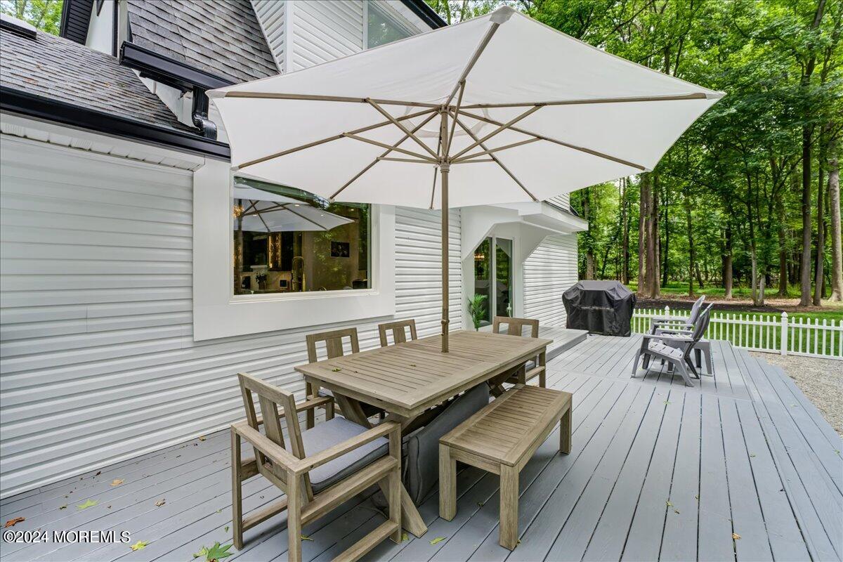 32 Devonshire Drive Morganville, NJ 07751 - Photo 38 of 53 an outdoor space with furniture and umbrella