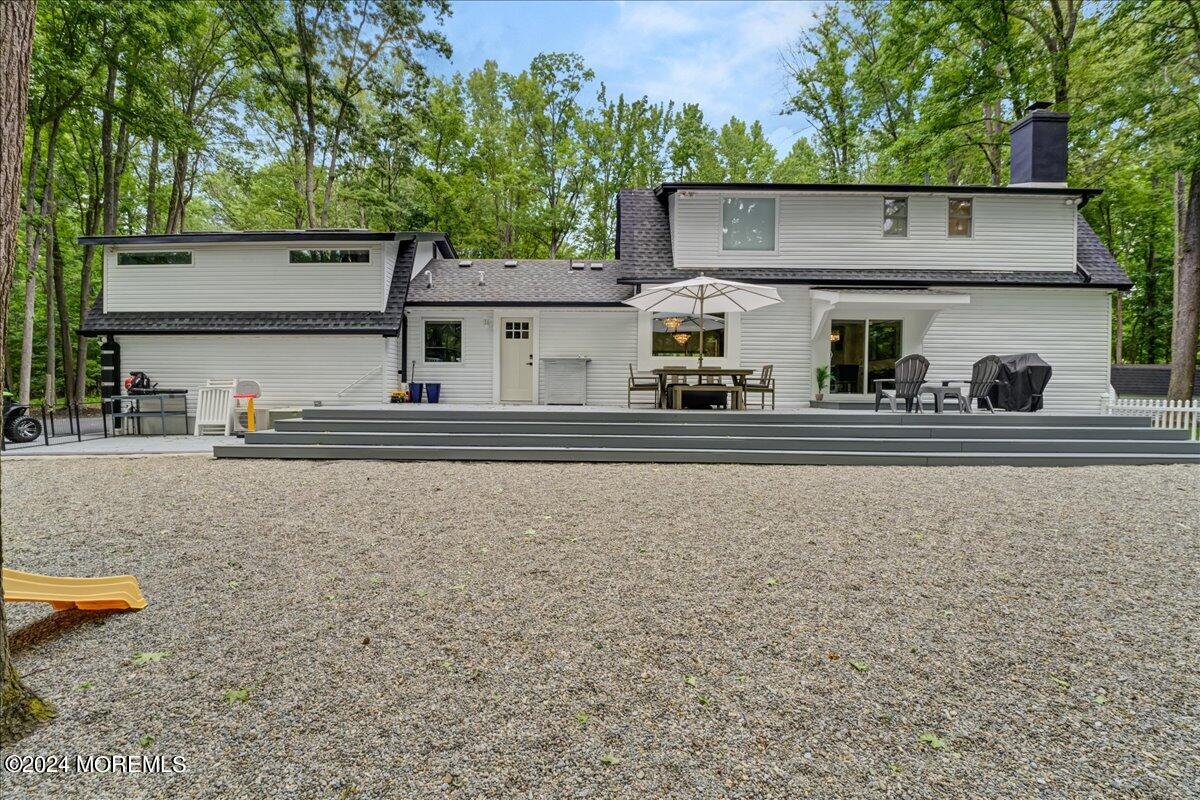 32 Devonshire Drive Morganville, NJ 07751 - Photo 40 of 53 front view of a house with a big yard