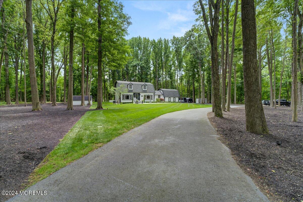 32 Devonshire Drive Morganville, NJ 07751 - Photo 4 of 53 a view of a park with large trees