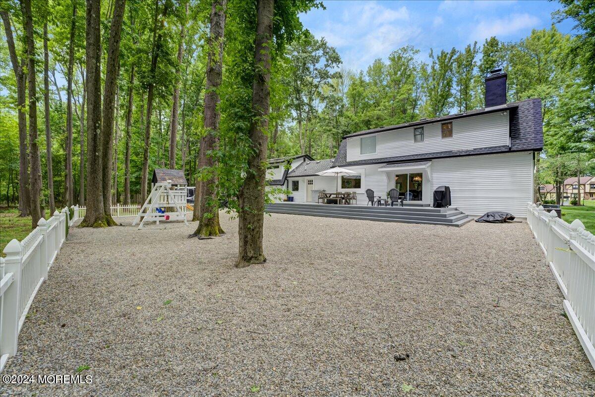 32 Devonshire Drive Morganville, NJ 07751 - Photo 41 of 53 front view of a house with a yard
