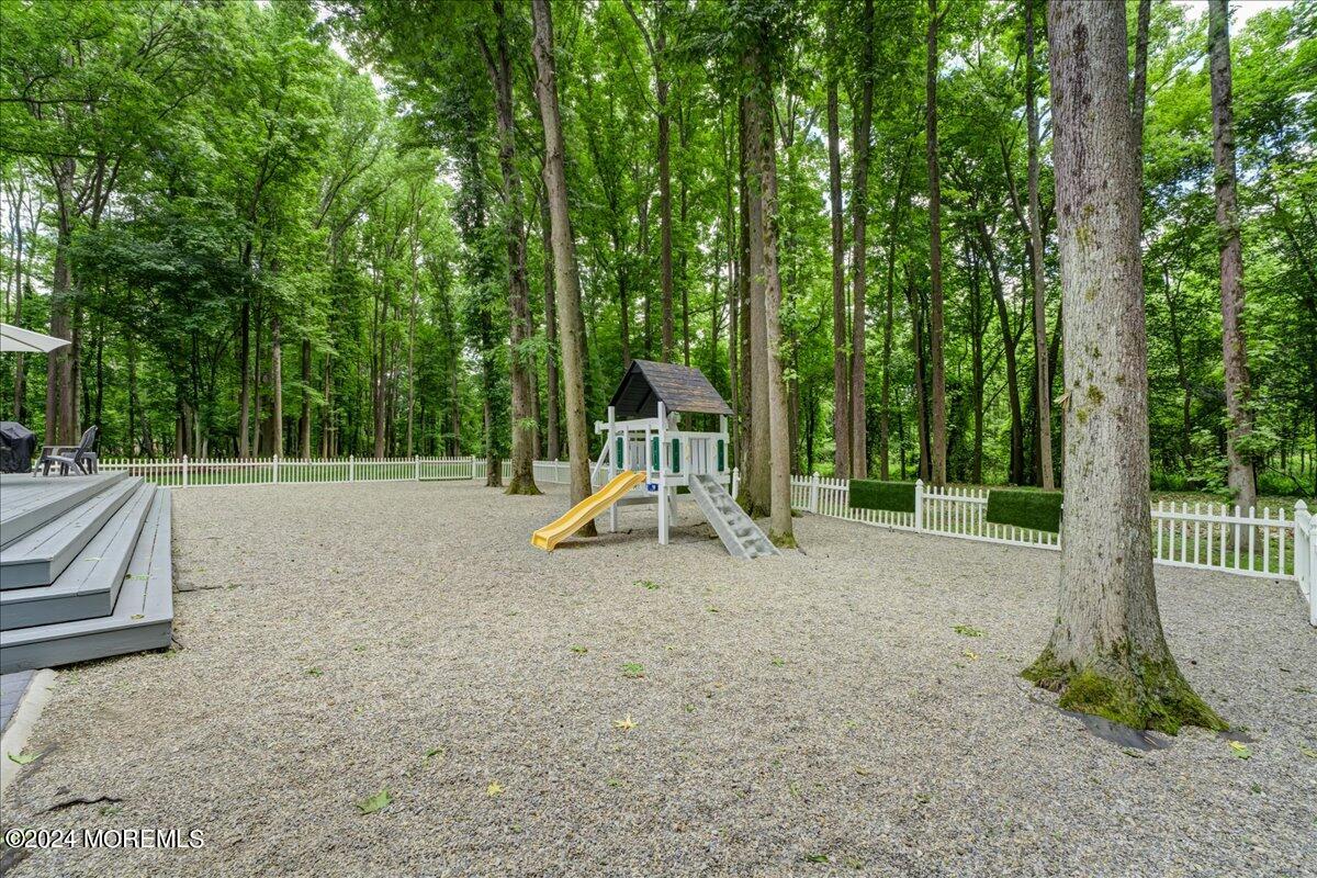 32 Devonshire Drive Morganville, NJ 07751 - Photo 42 of 53 a view of outdoor space with garden and trees