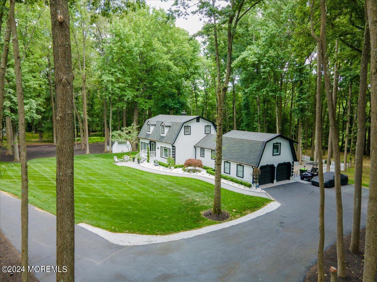 32 Devonshire Drive Morganville, NJ 07751 - Photo 47 of 53 a view of a small house with a small yard