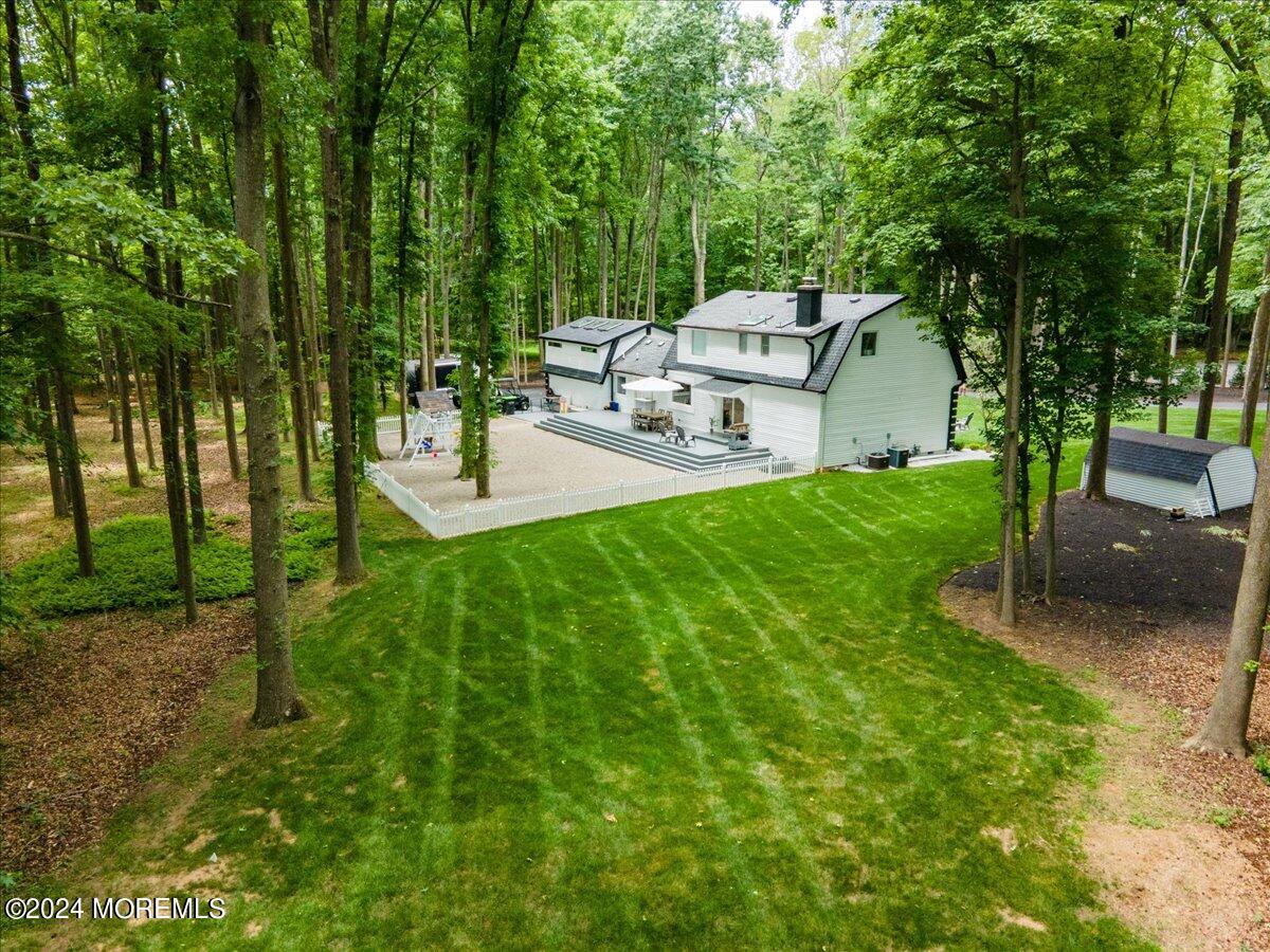 32 Devonshire Drive Morganville, NJ 07751 - Photo 48 of 53 a view of a backyard with sitting area