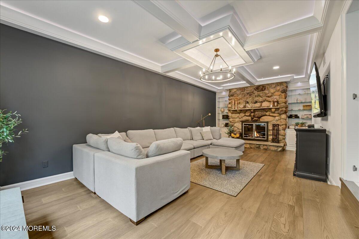 32 Devonshire Drive Morganville, NJ 07751 - Photo 9 of 53 a living room with furniture and a chandelier