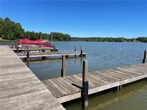 1111 Dockside Drive Buckhead, GA 30625 - Photo 2 of 15 a view of a wooden deck with a lake view