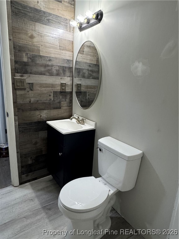 5733 Sagamore Road Hope Mills, NC 28348 - Photo 2 of 8 a bathroom with a toilet and a sink