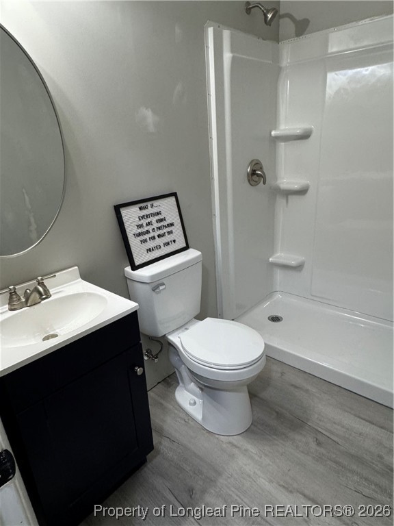 5733 Sagamore Road Hope Mills, NC 28348 - Photo 3 of 8 a bathroom with a sink a toilet and shower