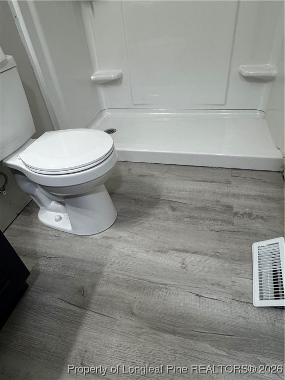 5733 Sagamore Road Hope Mills, NC 28348 - Photo 4 of 8 a bathroom with a toilet and a shower