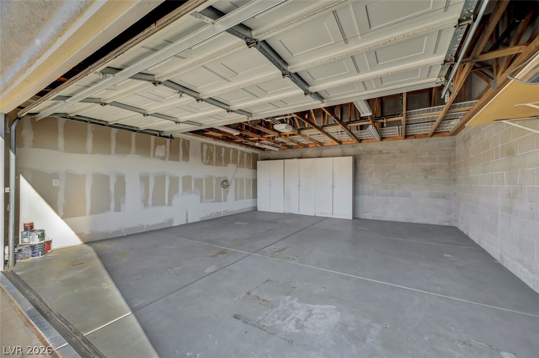 640 North Racetrack Road Henderson, NV 89015 - Photo 60 of 65 Ample storage solutions elevate this spacious garage, providing functional utility.