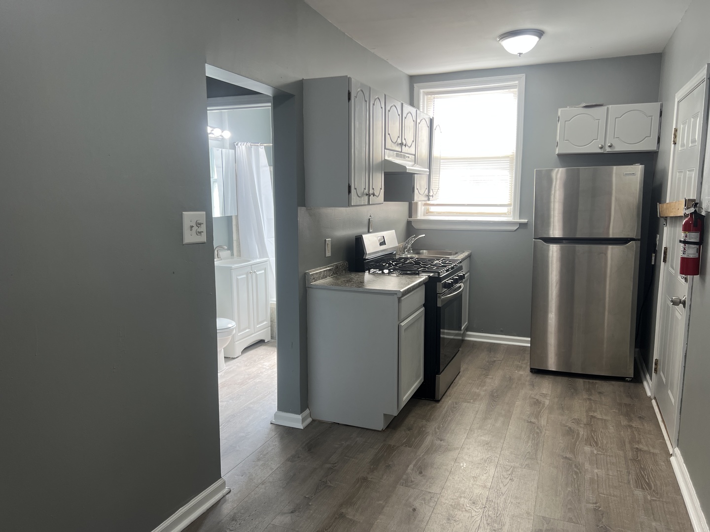 239 East 108th Street, Unit 2 Chicago, IL 60628 - Photo 5 of 7 a kitchen with a refrigerator a sink and dishwasher