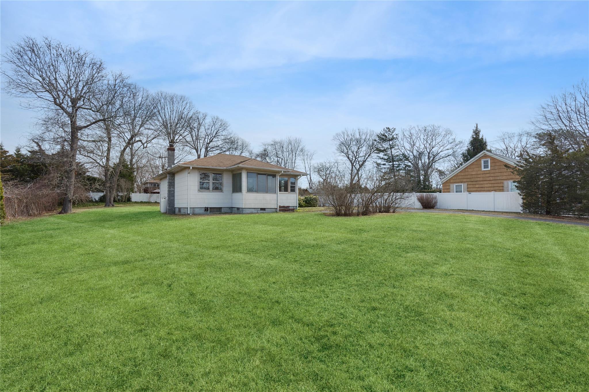 View of yard featuring fence