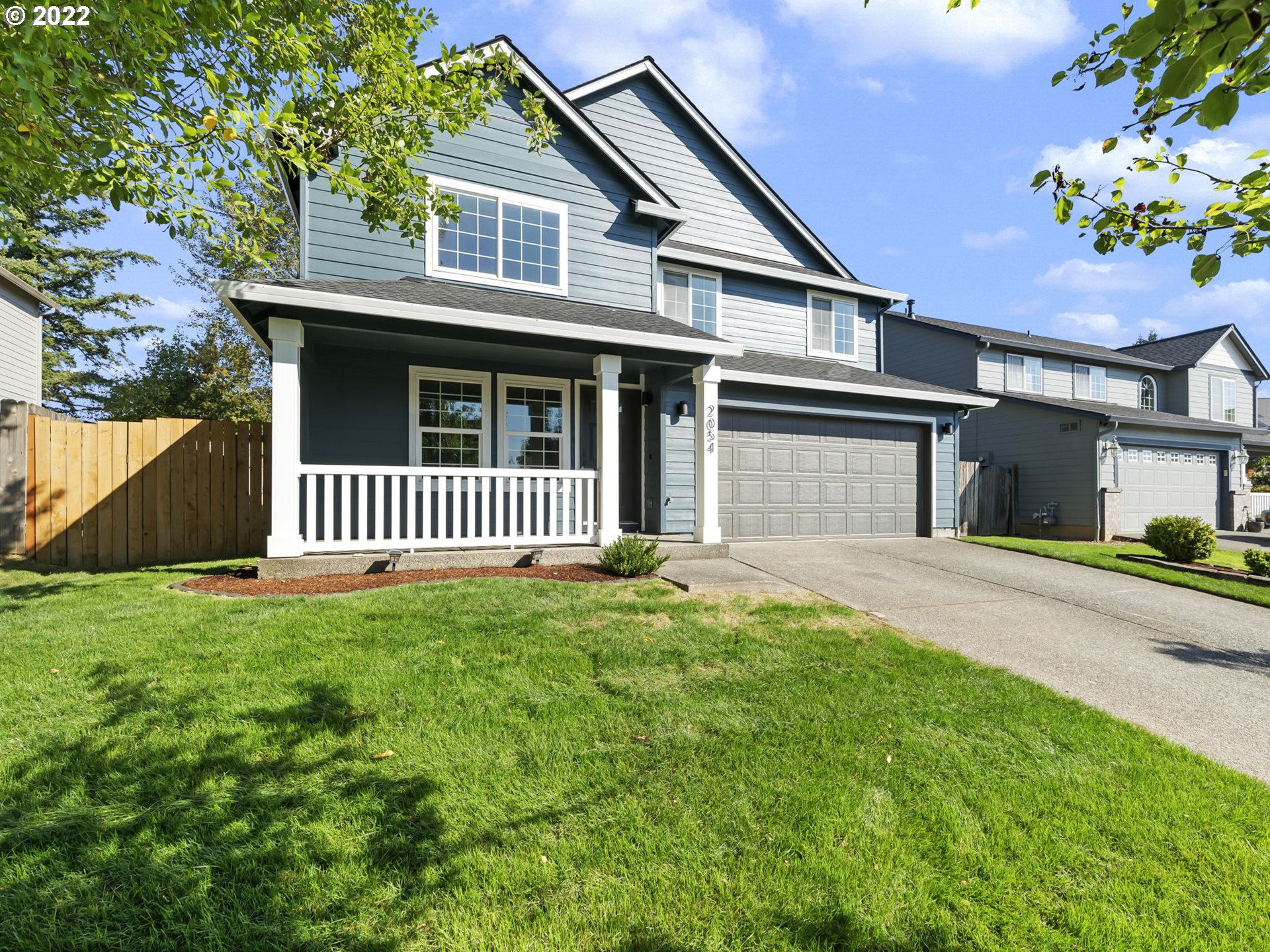 2054 North 9th Way Ridgefield, WA 98642 - Photo 3 of 32 a front view of a house with a garden
