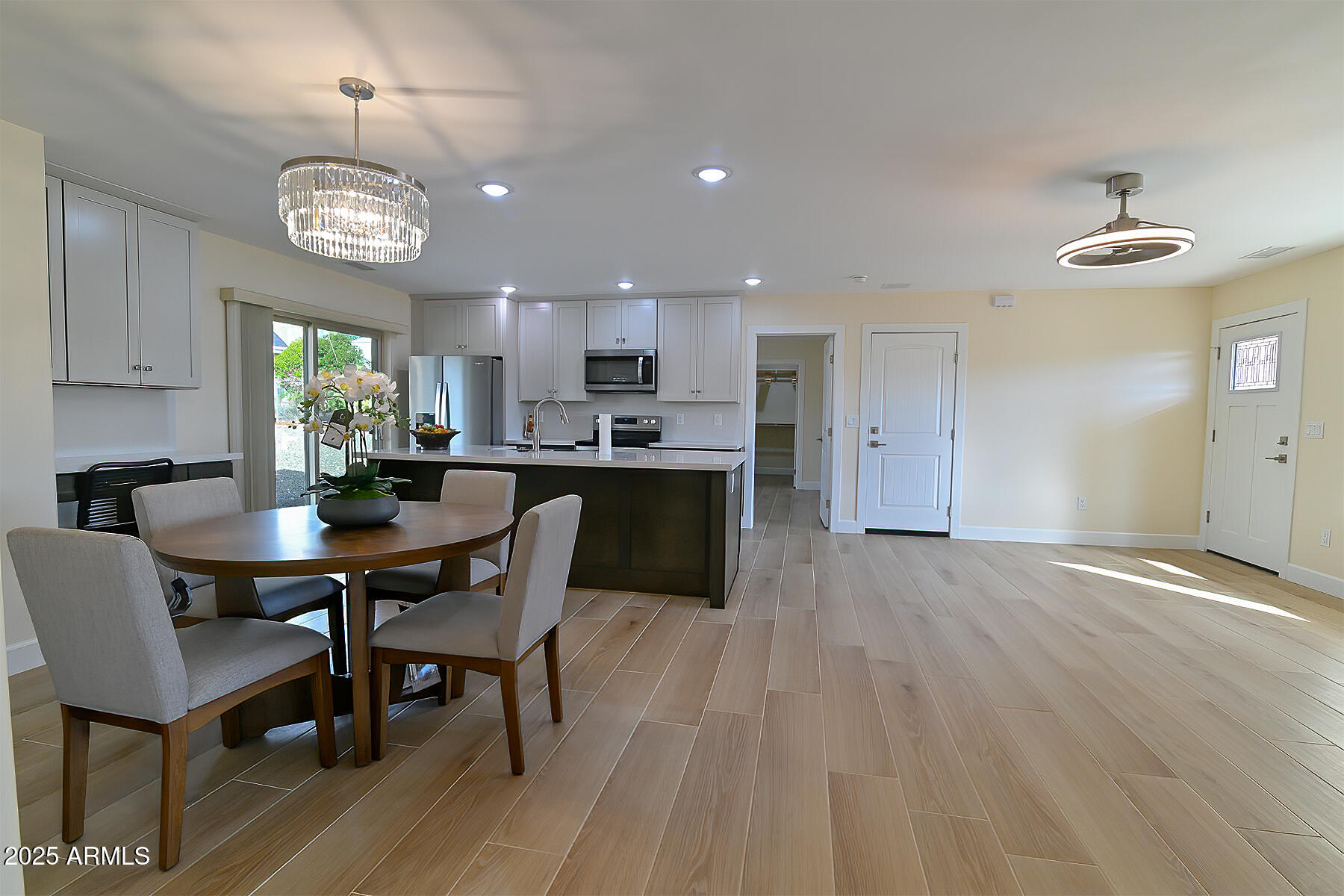 20214 East Mesa Verde Road Mayer, AZ 86333 - Photo 3 of 26 a view of a dining room with furniture and chandelier