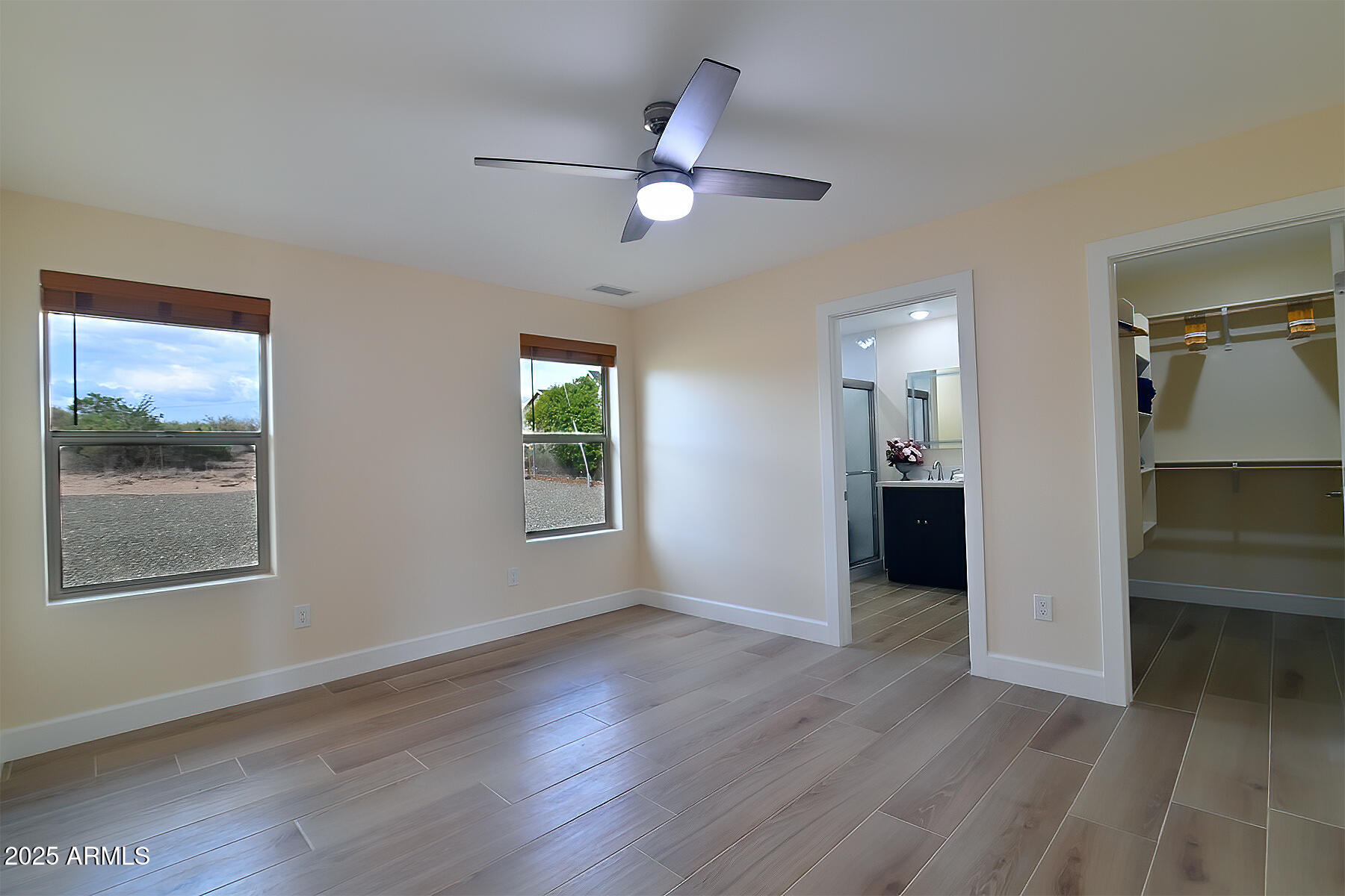 20214 East Mesa Verde Road Mayer, AZ 86333 - Photo 6 of 26 wooden floor in an empty room with a window