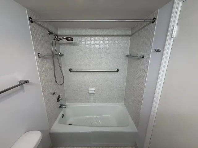 a bathroom with a shower and a toilet