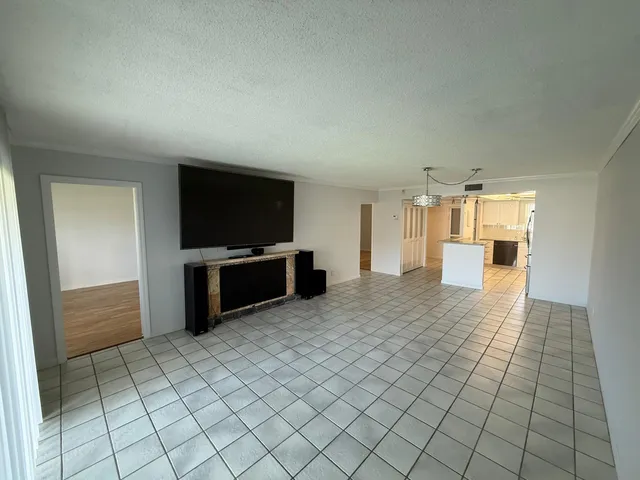 a view of a room with cabinet and flat screen tv