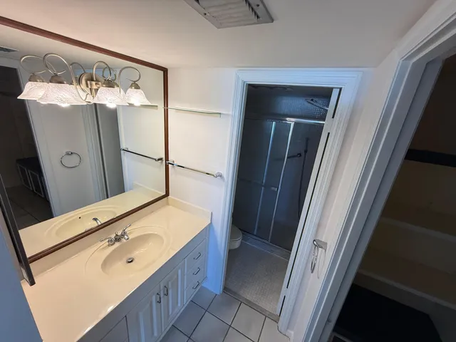 a bathroom with a sink and mirror