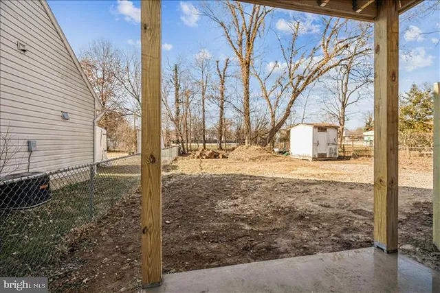 a kitchen with stainless steel appliances granite countertop a refrigerator stove top oven and sink
