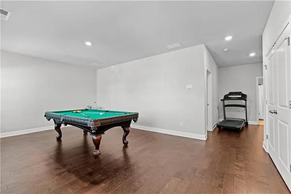 a room with furniture and a wooden floor