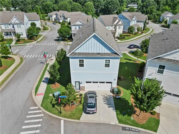 an aerial view of a house with a garden and plants