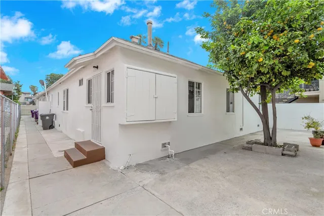 a view of a house with a tree