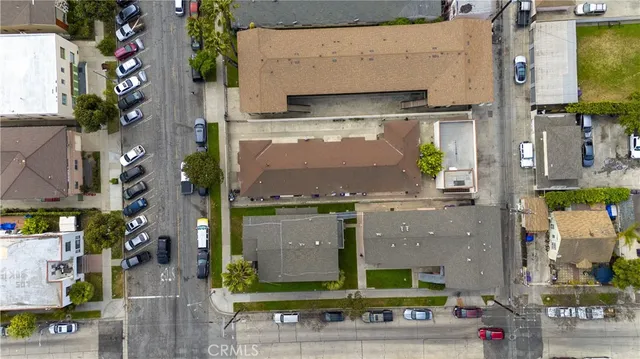 an aerial view of a building with street