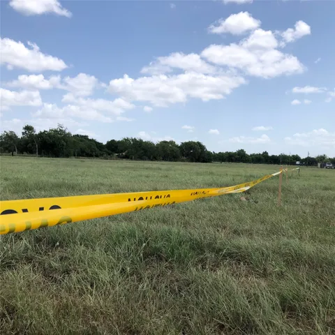 a view of a lake with houses in the back