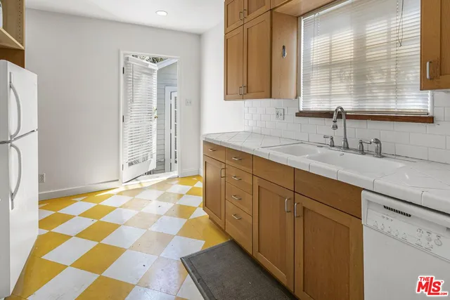 a bathroom with a sink a vanity and a mirror