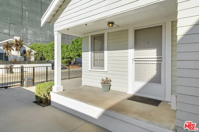 a view of a house with porch and wooden floor
