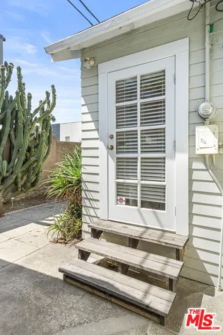 a view of backyard with a balcony
