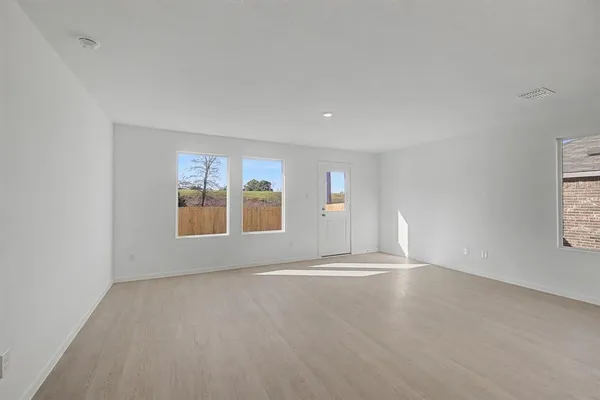 an empty room with windows