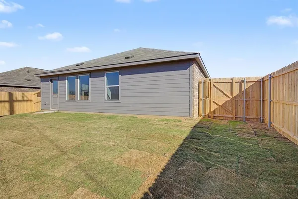 a house view with a backyard space