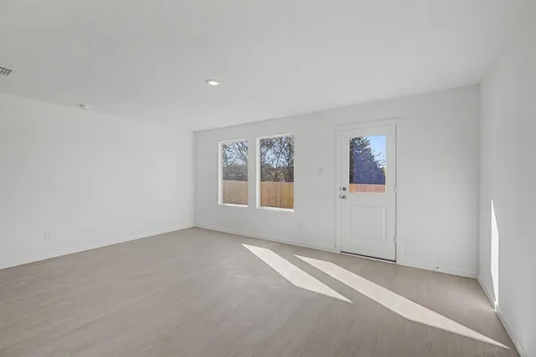 a view of an empty room with a window
