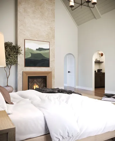 a bedroom with a bed and a fireplace