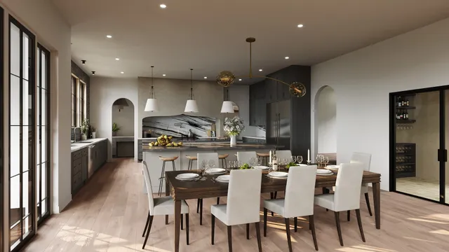 a kitchen with stainless steel appliances kitchen island granite countertop a table chairs and a refrigerator