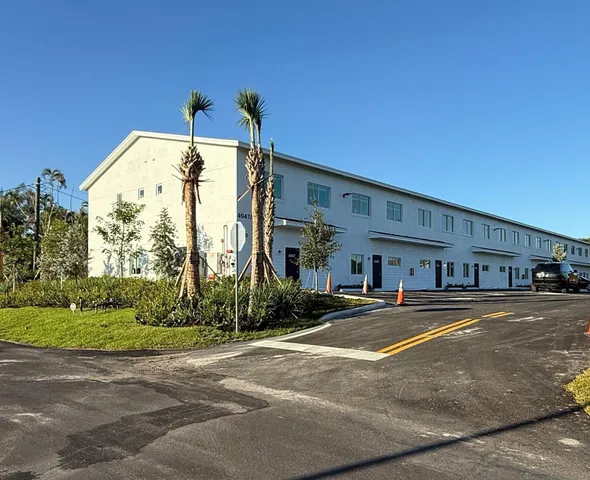 a view of a building with a street