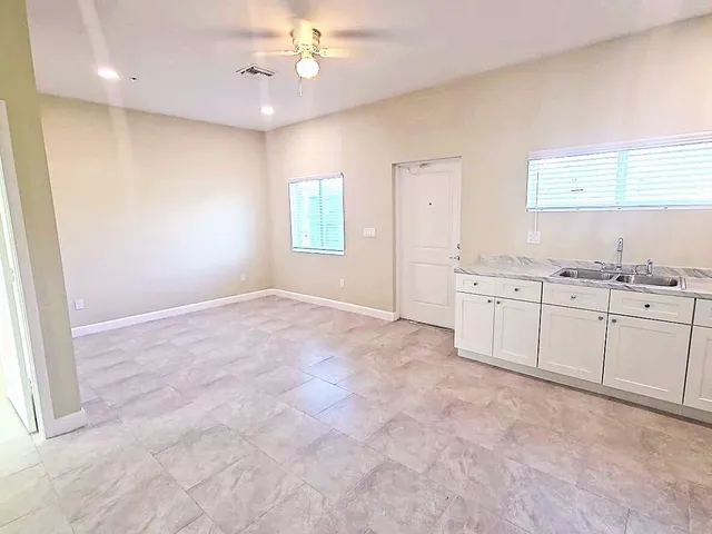 a view of a kitchen with marble kitchen and a window